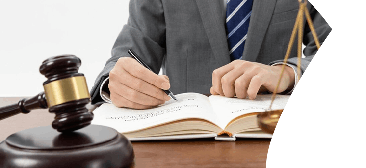 Person writing in legal book